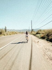 biking on the side of the road 